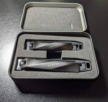 two clippers in a black case 