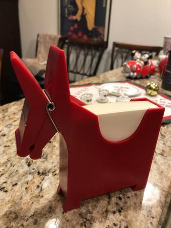 reviewer image of the red donkey memo holder on a granite surface