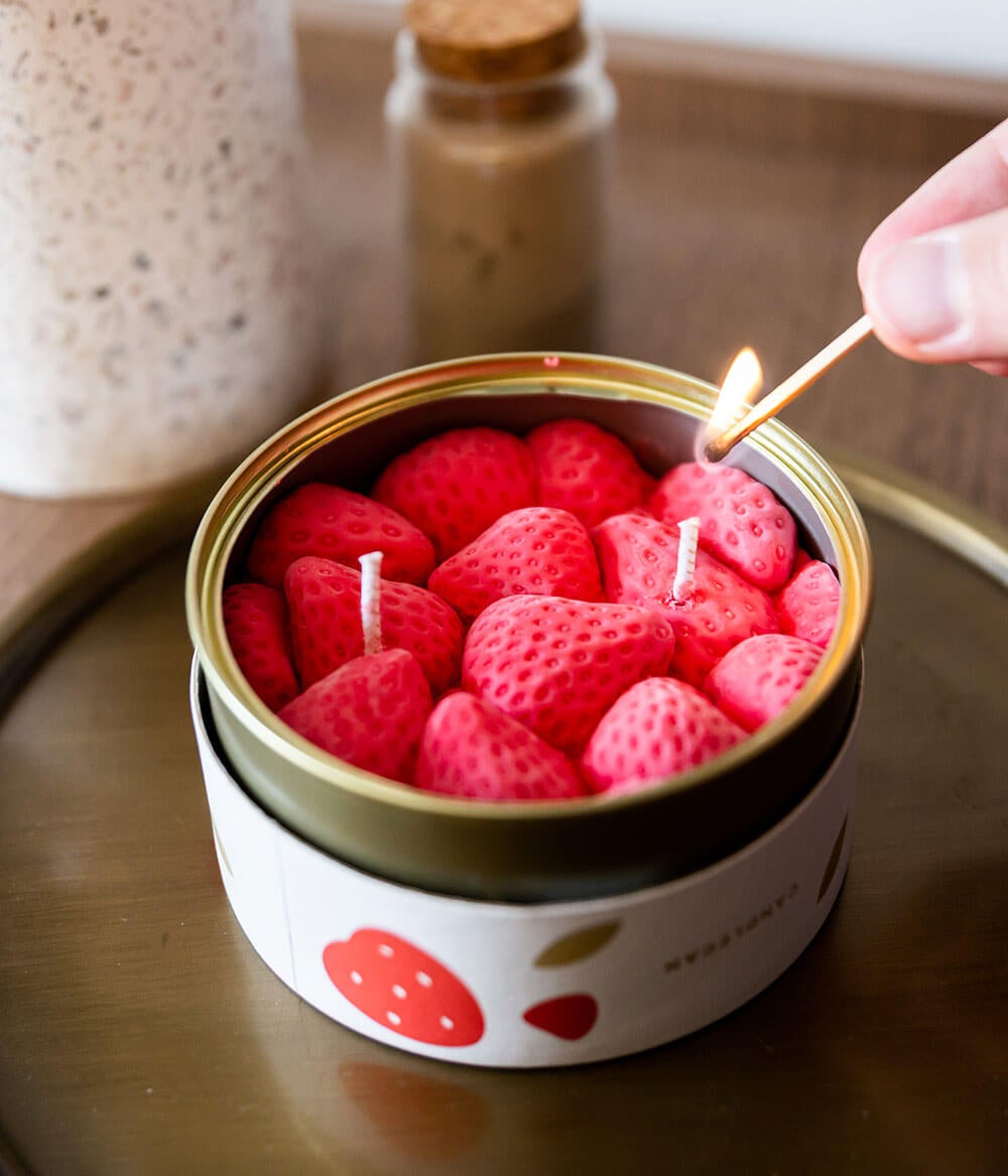 can with soy wax candle that looks like a tin of strawberries