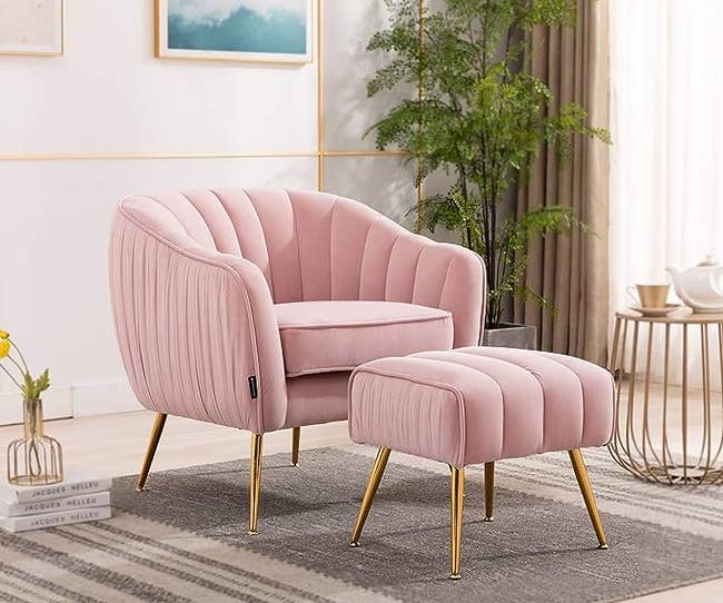 The pink chair and ottoman in a living room