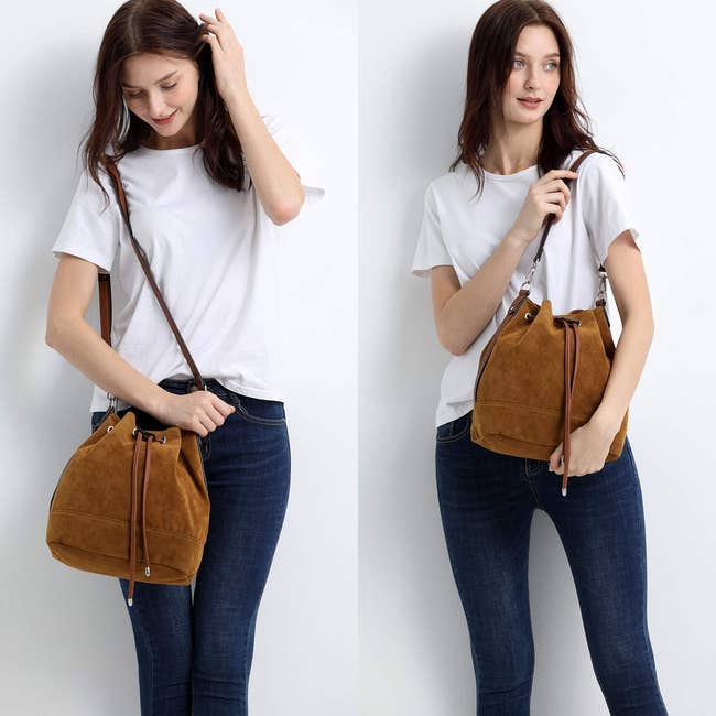 Woman in a white t-shirt and jeans showcasing a brown suede bucket bag, styled crossbody and shoulder
