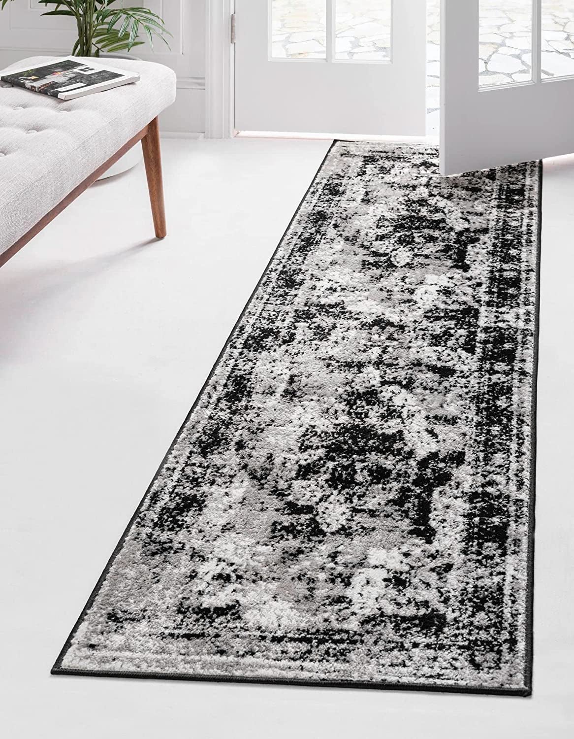 black, gray, and white rug runner with antique-inspired design