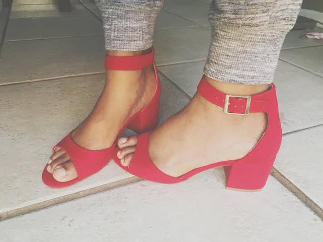 reviewer pic of the short heeled open-toe sandal in bright red