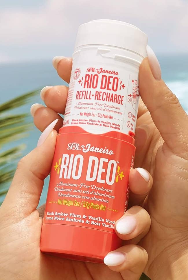 Hand holding a bottle of Rio Deo roll-on deodorant