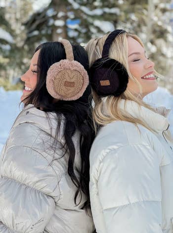 two models posing in the tan and black earmuffs