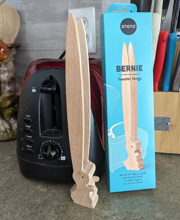 reviewer's rabbit tongs standing on kitchen counter beside packaging