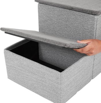 Gray two-step fabric stair with model lift open bottom stair's top