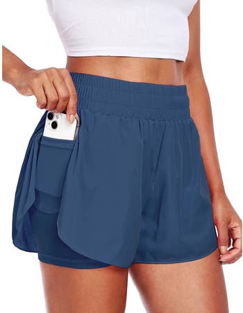 person placing telephone  successful  pouch  of diversion  shorts