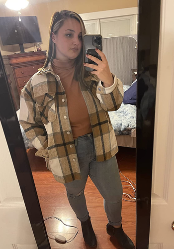 reviewer mirror selfie wearing tan plaid shacket