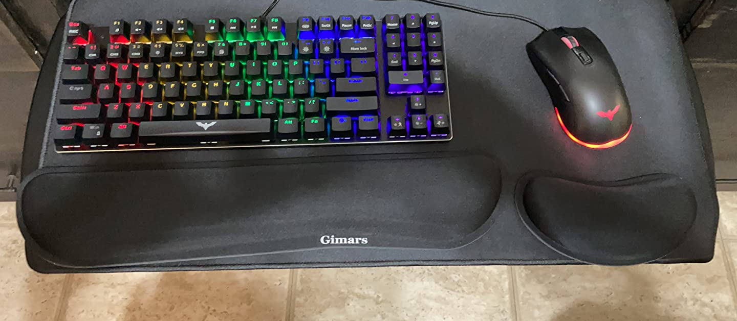 Reviewer's keyboard and mouse with memory foam wrist pads