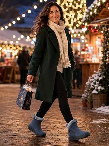 Woman successful wintertime coat, scarf, and boots holding a acquisition bag, walking done a festive marketplace with lights and woody stalls