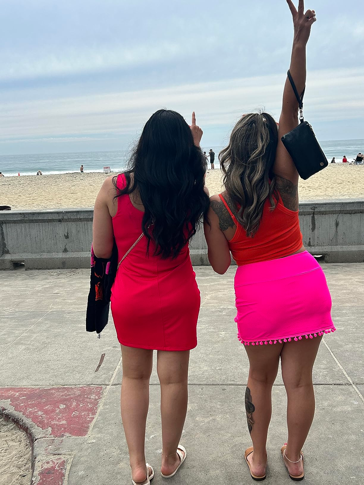 reviewer showing back view of the pink skirt