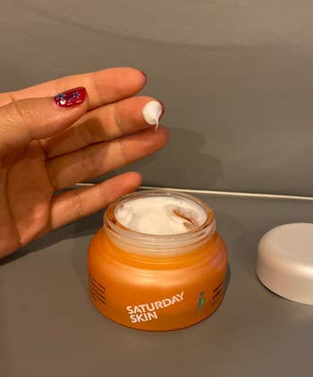 Reviewer's photo of fingertip dipped in moisturizer