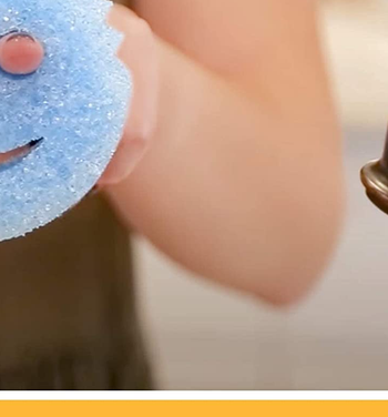 person holding blue scrub daddy