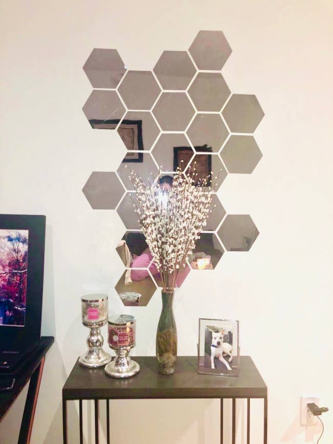 A reviewer's set of hexagon-shaped mirrors on the wall