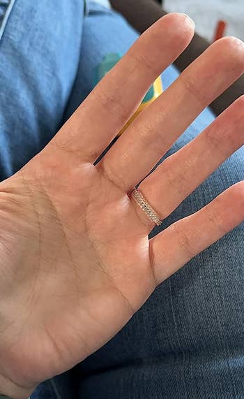 a reviewer wearing a ring with the adjuster on it 