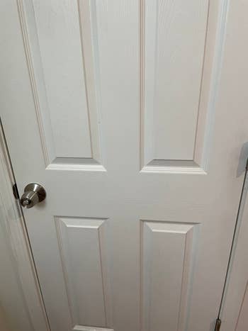 the after results showing a clean white door