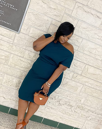 Reviewer wearing navy midi dress