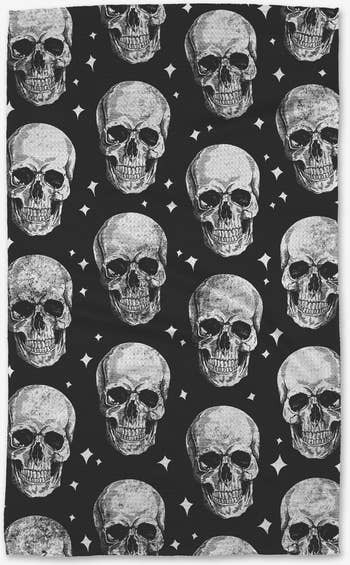 the black and white tea towel with a skull pattern