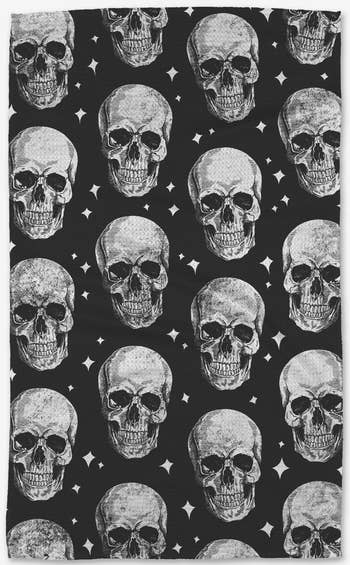 the black and white tea towel with a skull pattern