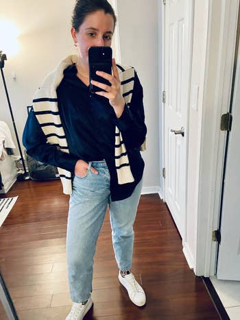 BuzzFeed editor Abby Kass wearing the jeans in a light wash