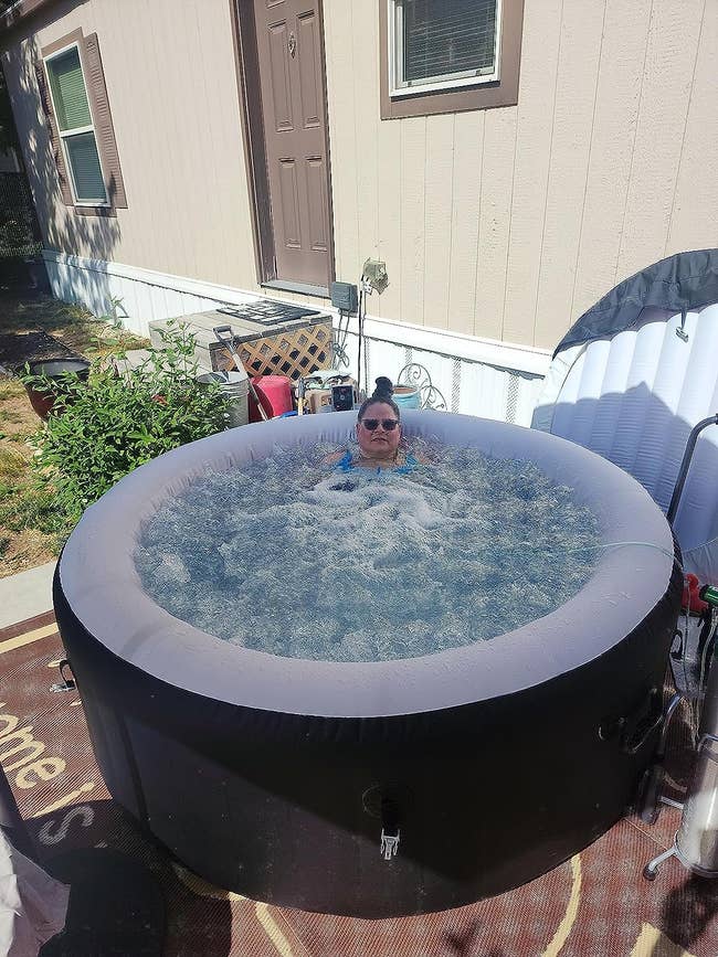A reviewer in the hot tub