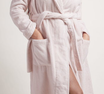 closeup torso shot, model wearing pink bathrobe