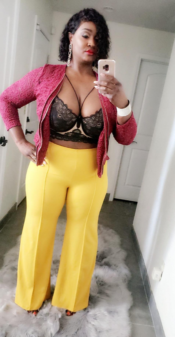 another reviewer wearing the pants in yellow with a lace top and jacket