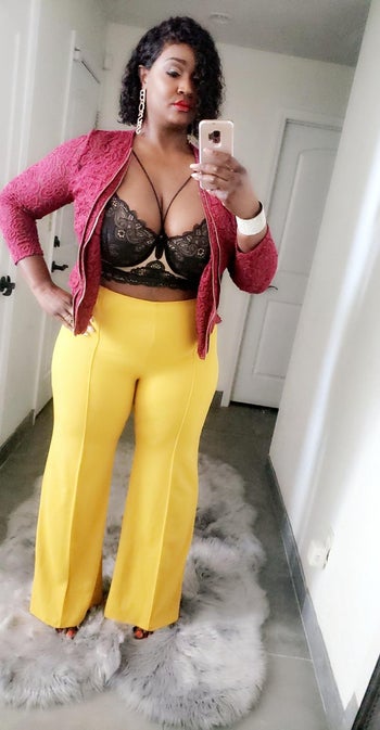 another reviewer wearing the pants in yellow with a lace top and jacket