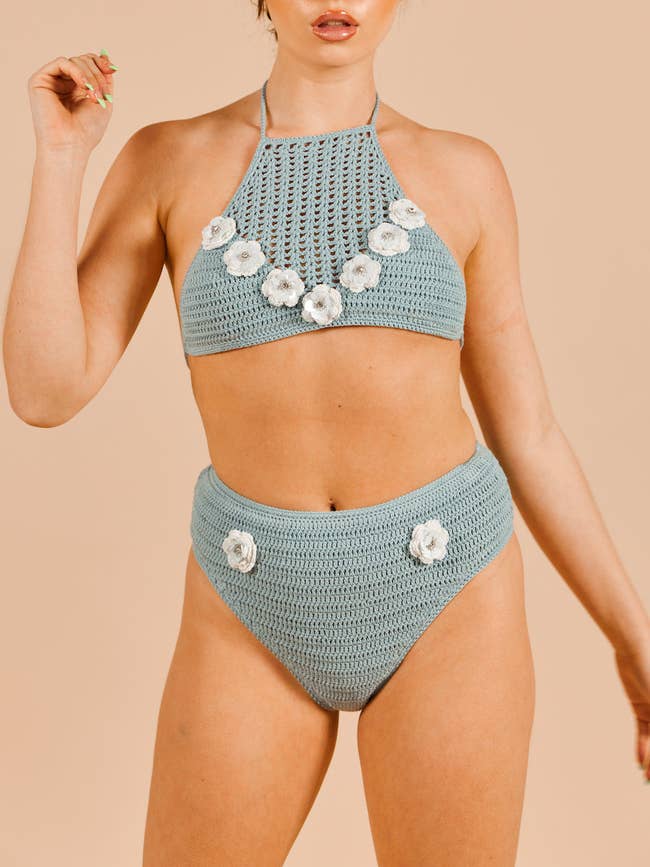a model wearing the blue and white bathing suit set