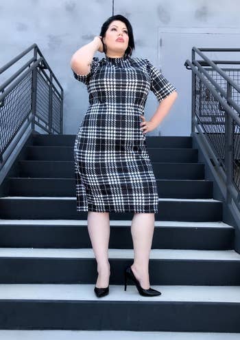 reviewer in black and white gingham bodycon dress
