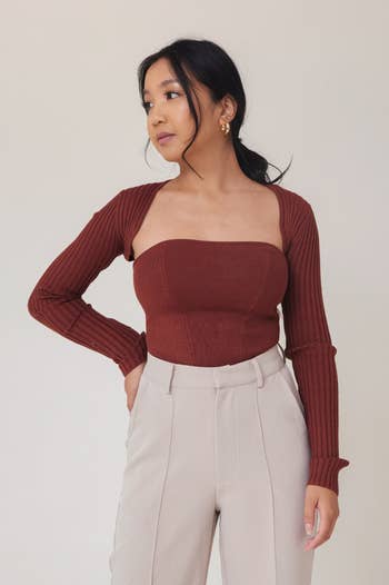 a model wearing the sweater set in the color chocolate
