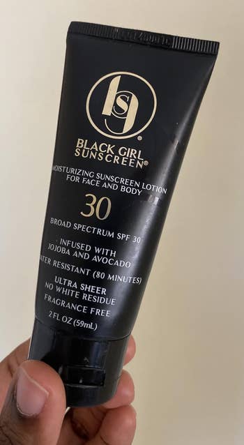 A idiosyncratic holding the sunscreen