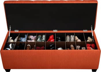 Open retention  seat  with compartments organizing assorted  shoes. Ideal for creating space-efficient, stylish location  enactment     solutions