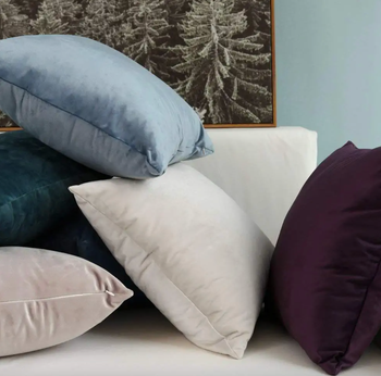 A pile of pillows in different colors