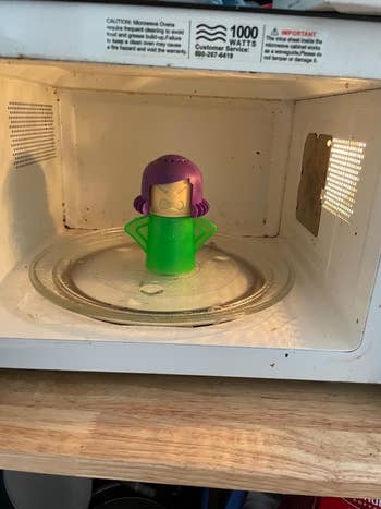 the same microwave looking much cleaner, with the angry mama inside