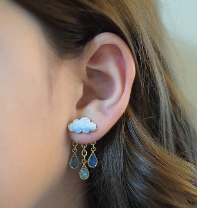 model wearing the blue cloud and raindrop earrings