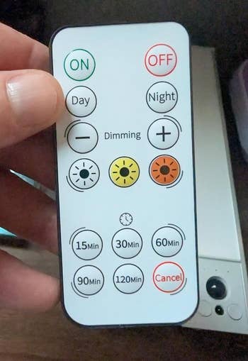 Remote power  for a light, featuring on/off, day/night modes, dimming options, timer settings from 15 to 120 minutes, and a cancel button
