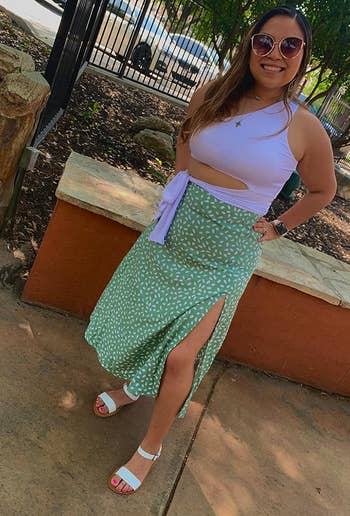 Another reviewer posing in the green and white skirt