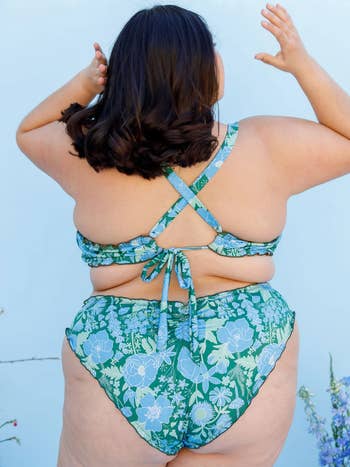 back of suit shown worn by plus size model
