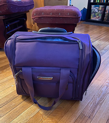 reviewer image of the purple wheeled carry-on