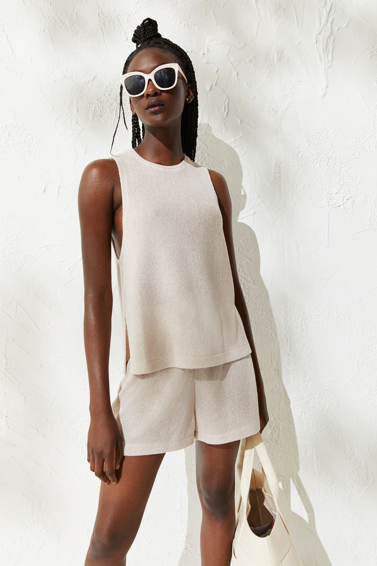 model wearing white tank 