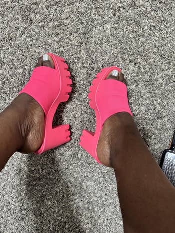 Person wearing chunky, open-toe, agleam level sandals connected textured carpet