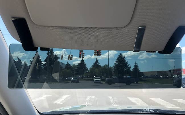 a reviewer photo of the polarized visor installed in a car 