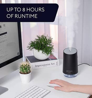 the black humidifier sitting on a desk