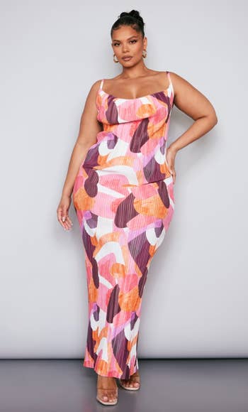 front view of a model in the cowl neck abstract maxi dress
