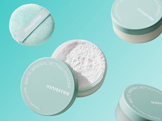 Innisfree Matte Mineral Setting Powder, unfastened and closed containers with a pulverization puff, floating connected a turquoise background