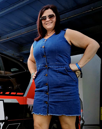 Reviewer wearing blue mini dress