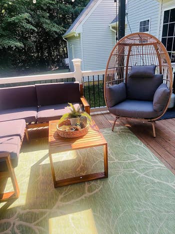 egg-shaped wicker chair on furnished patio