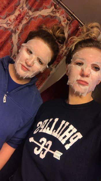two reviewers with the sheet masks on their faces